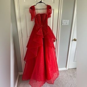 Beautiful custom made red ball gown -fits size small.